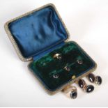 A cased set of yellow metal mounted banded agate shirt studs and pair of cufflinks, together with