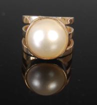 A yellow metal and split pearl dress ring, size 'J', gross weight 7 grams.