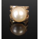 A yellow metal and split pearl dress ring, size 'J', gross weight 7 grams.