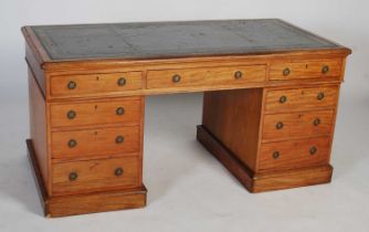 A 19th century mahogany pedestal desk, the rectangular top with green leather skiver with gilt