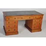 A 19th century mahogany pedestal desk, the rectangular top with green leather skiver with gilt