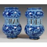 A pair of Italian pottery drug jars of Alberello form, one inscribed 'E-Di-Psilio', the other