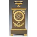 An early 19th century French bronze and gilt metal mantle clock, the circular dial with Roman