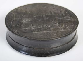 A pressed horn circular snuff box, the pull-off cover with detailed river scene of fishing boat,