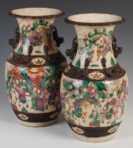 A pair of Chinese porcelain famille rose crackle glazed Warrior vases, late Qing Dynasty,