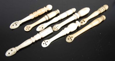 A group of eight Scottish bone snuff spoons of various shapes and sizes, with carved turned baluster