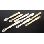 A group of eight Scottish bone snuff spoons of various shapes and sizes, with carved turned baluster