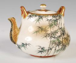 A Japanese satsuma pottery miniature teapot and cover, Meiji Period, decorated with bamboo under a