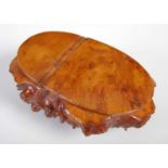 A Scottish burr wood snuff box with integral hinge, richly grained cover and base of naturalistic