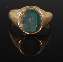 A 9ct gold and blood stone signet ring, gross weight 6.6 grams.