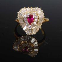 A yellow metal ruby and diamond cluster ring, centred with a pear-shaped ruby calculated to weigh
