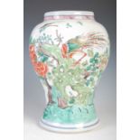 A Chinese porcelain famille verte vase, Qing Dynasty, decorated with birds and blossom, blue 'double