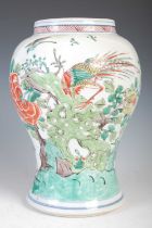 A Chinese porcelain famille verte vase, Qing Dynasty, decorated with birds and blossom, blue 'double