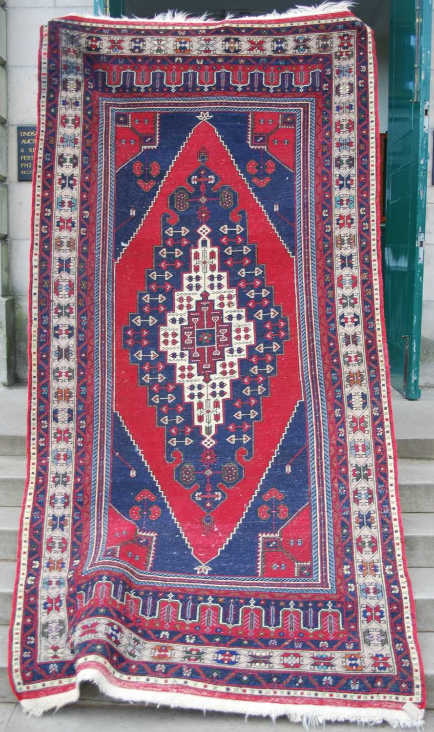 A Persian long rug, 20th century, the rectangular madder ground centred with a large lozenge - Bild 3 aus 6