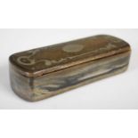 A horn oblong snuff box, the integral hinged cover with silvered-metal scroll inlay around oval