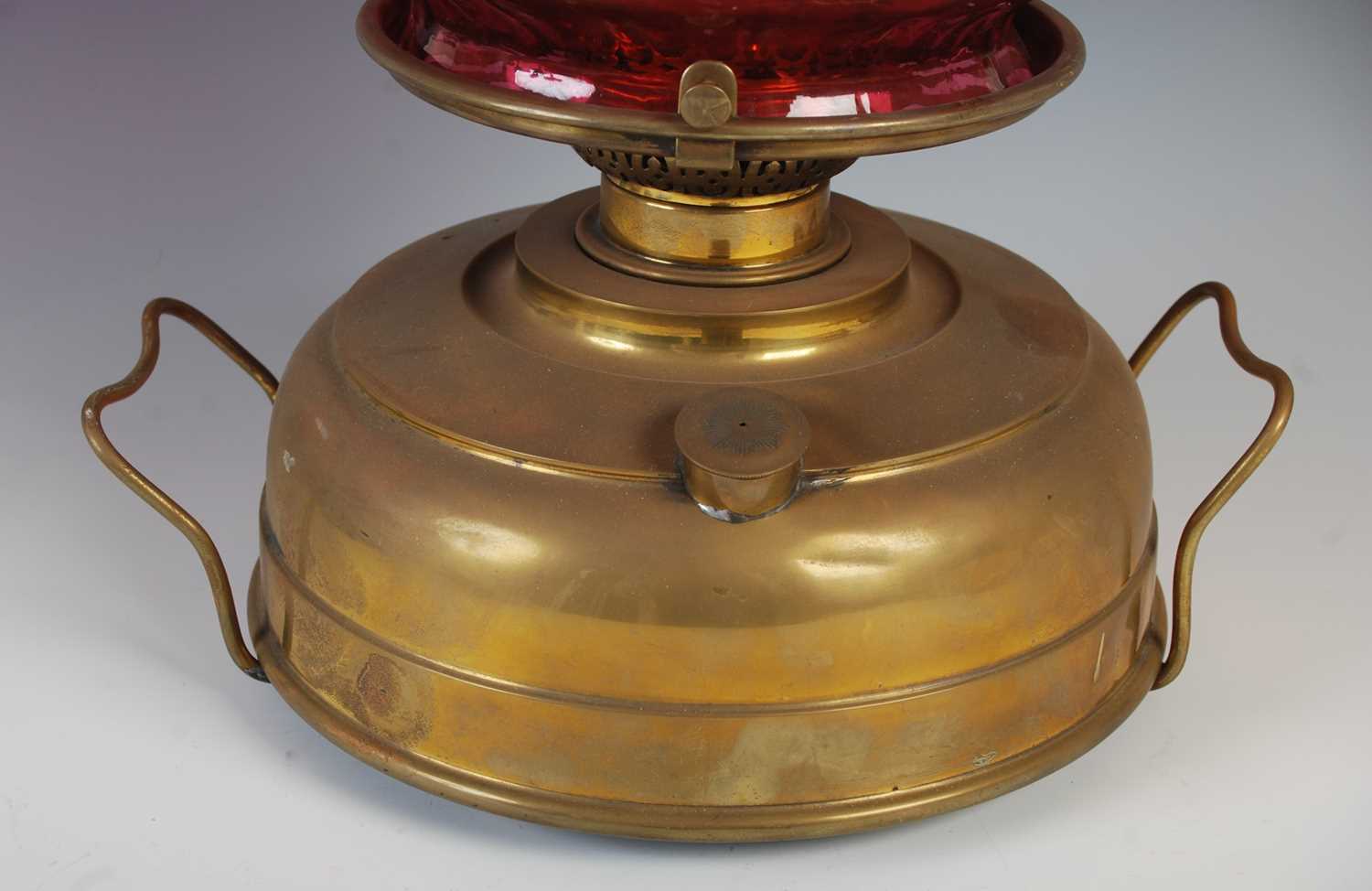 A late 19th century brass oil burning paraffin lamp, with ruby glass shade, 42.5cm high. - Image 5 of 5