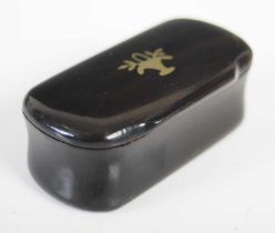 A small tortoiseshell rounded oblong snuff box with incurved sides, the hinged cover inset with a