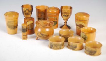 A collection of Mauchline Ware, to include four napkin rings, two decorated with 'Glasgow Green' and