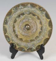 A Chinese bronze mirror, of circular form, cast with two borders of Archaic style motifs, 13cm