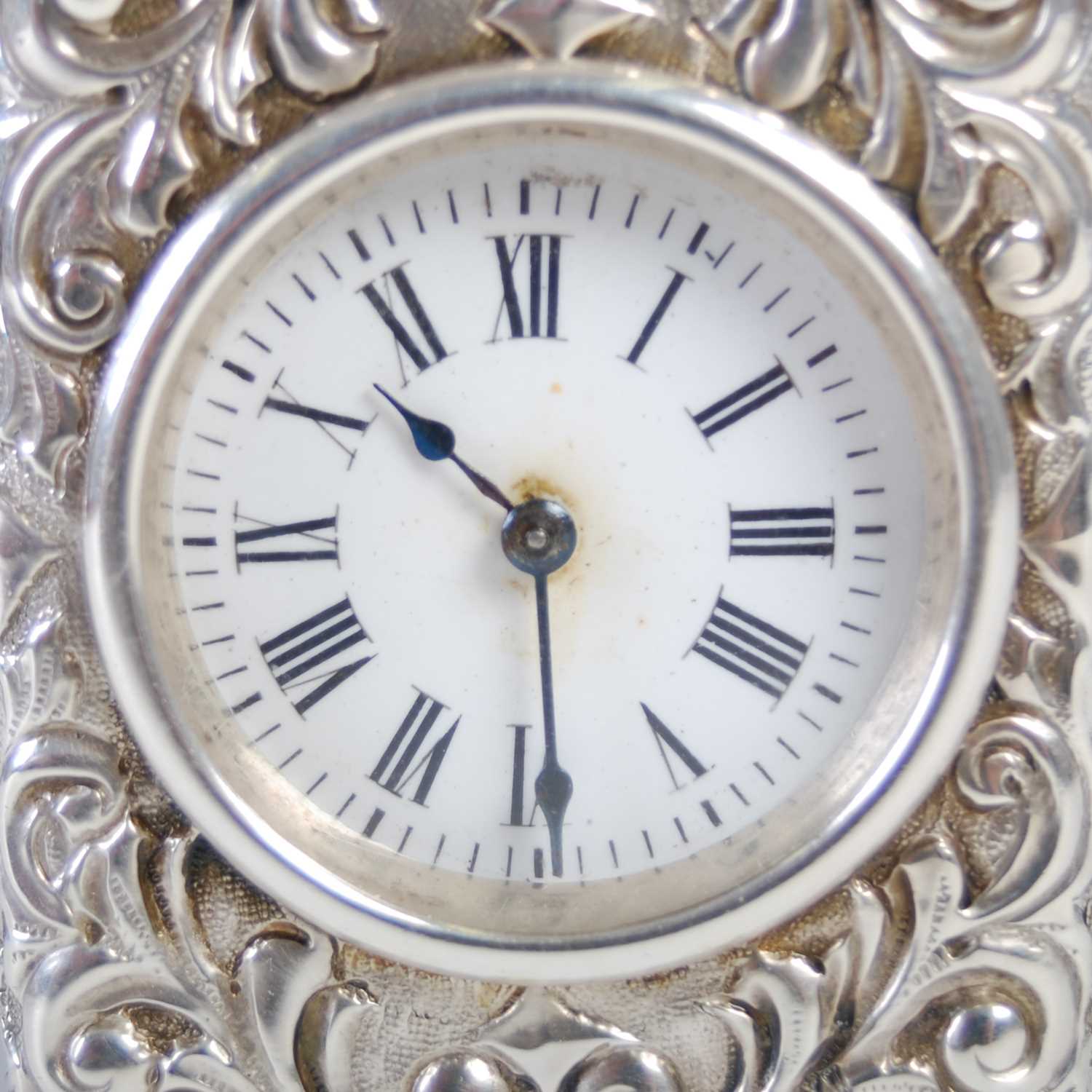 A late 19th century silver carriage clock, the white enamel dial with Roman numerals, in richly - Image 3 of 7