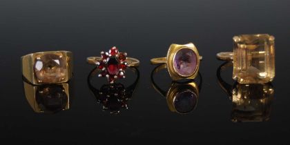 A collection of four assorted 9ct gold gem set dress rings, gross weight 15.6 grams (4).