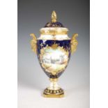 A Coalport hand-painted blue ground urn and cover, decorated with a view of Balmoral Castle,