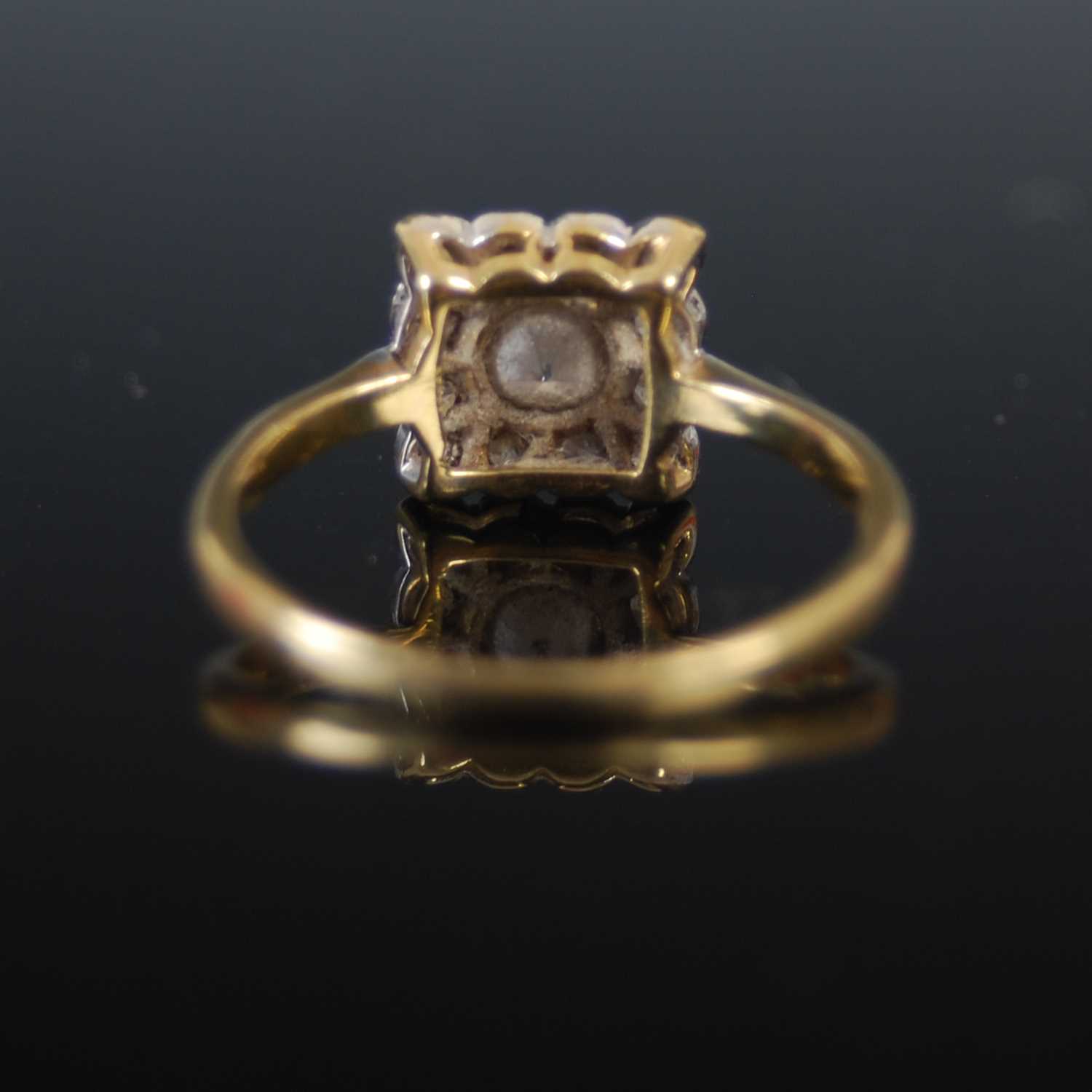 A yellow and white metal diamond cluster ring, set with a central round brilliant cut diamond in a - Image 3 of 4