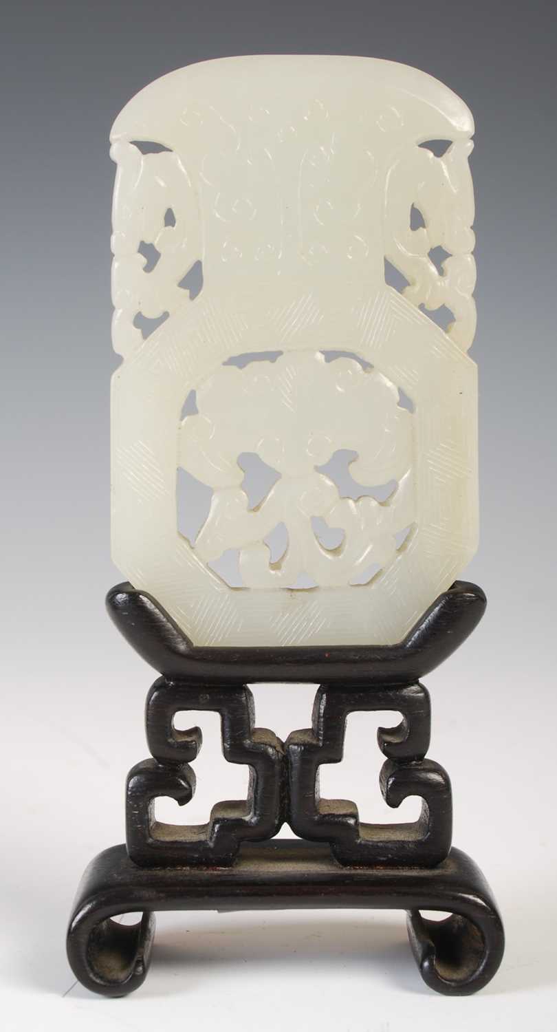 A Chinese pale celadon jade panel, carved and pierced in the form of a vase with dragon handles, the - Image 2 of 5