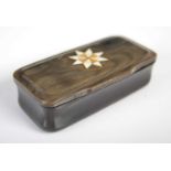 A horn oblong snuff box with incurved sides and integral hinged cover inlaid with a treen and bone