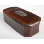 A Scottish leather cut-cornered oblong snuff box with integral leather hinge, silver plaque engraved