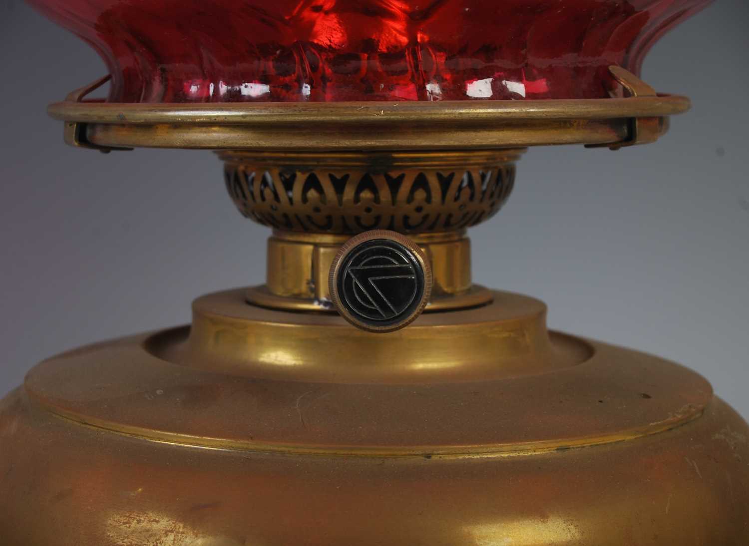 A late 19th century brass oil burning paraffin lamp, with ruby glass shade, 42.5cm high. - Image 2 of 5