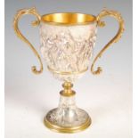 A Victorian silver-plated and gilt metal twin-handled cup, decorated in high relief with a frieze of