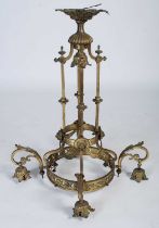 A late 19th/ early 20th century brass four-light hanging chandelier, set with four foliate cast