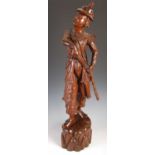 A large carved wood figure of a Japanese official, 20th century, wearing a helmet and carrying a