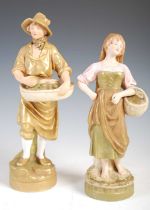 Two Royal Dux porcelain figures, comprising male fruit picker holding a basket laden with fruit,