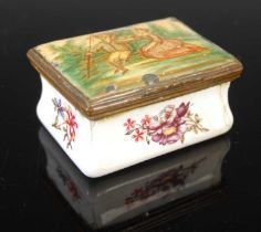 An 18th century Battersea enamel patch box, the hinged rectangular cover decorated with scene of