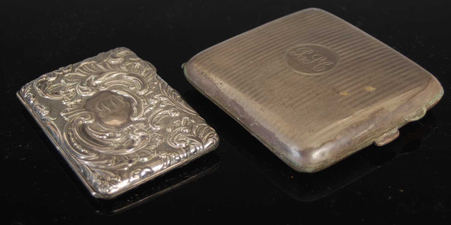 An Edwardian silver calling card case, Birmingham 1901, of hinged rectangular form opening to a blue