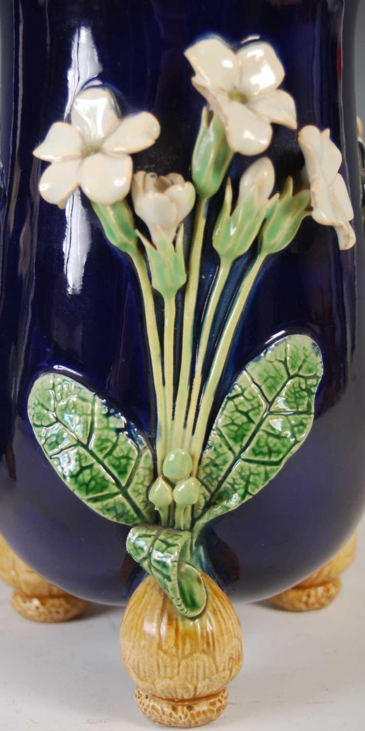 A pair of Minton Majolica pottery vases, dated 1866, decorated in relief with three white petalled - Image 5 of 8