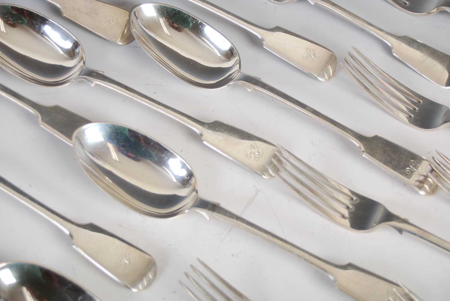 A composite suite of Victorian silver flatware, fiddle pattern, comprising twelve table forks, - Image 2 of 8
