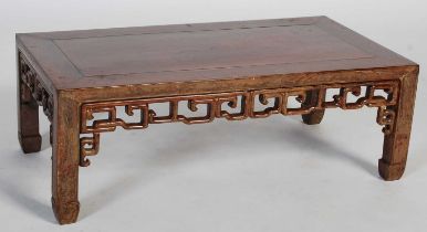 A Chinese dark wood Kang table, late 19th/ early 20th century, the rectangular panel top above a