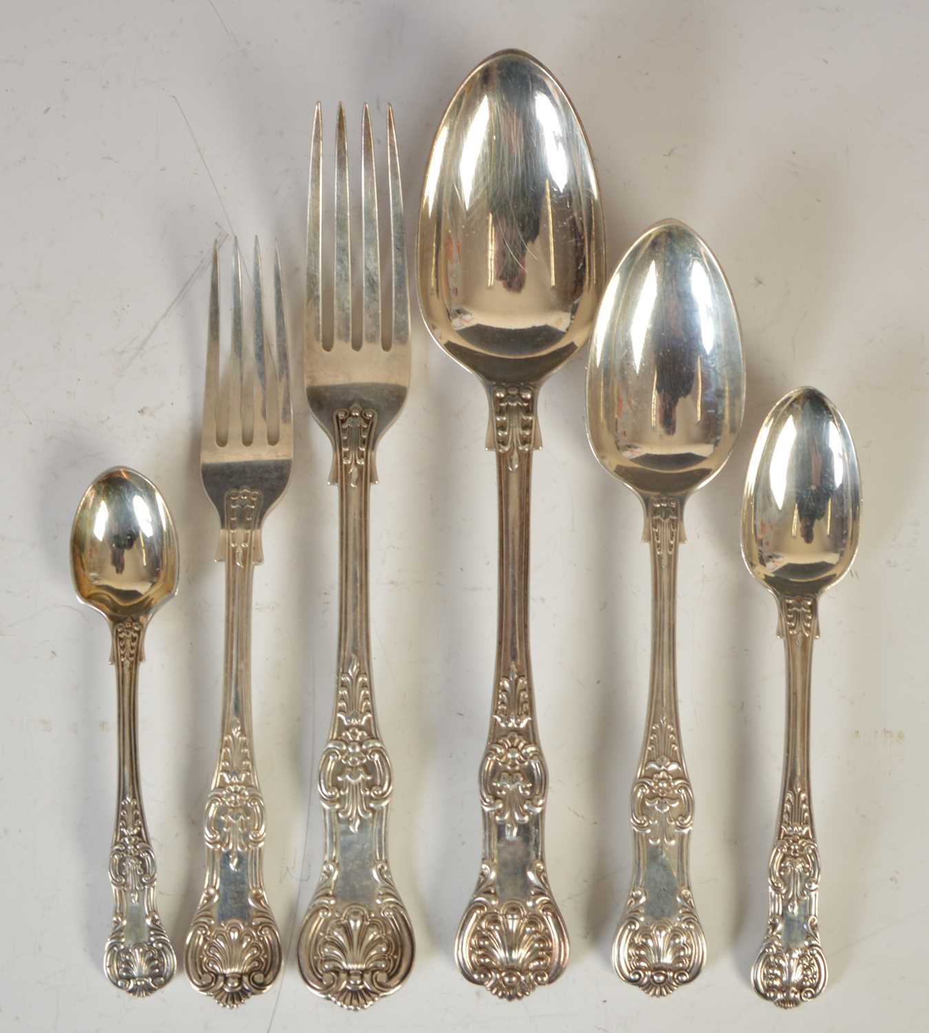 A Victorian and later twelve place setting of Kings pattern silver flatware, various makers and