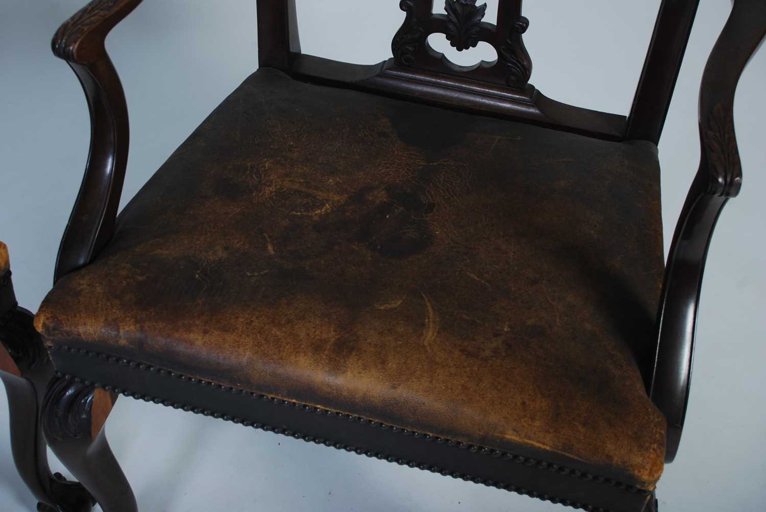 A pair of early 20th century George III style elbow chairs, the shaped top rail above a carved and - Image 6 of 7