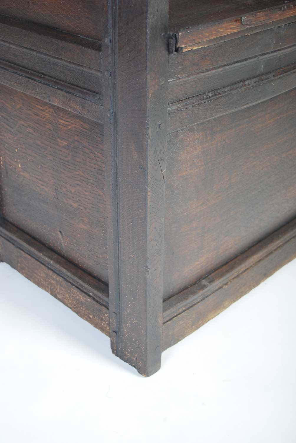 An 18th century oak lambing chair, the shaped top rail above a rectangular panelled back, the box - Image 4 of 6