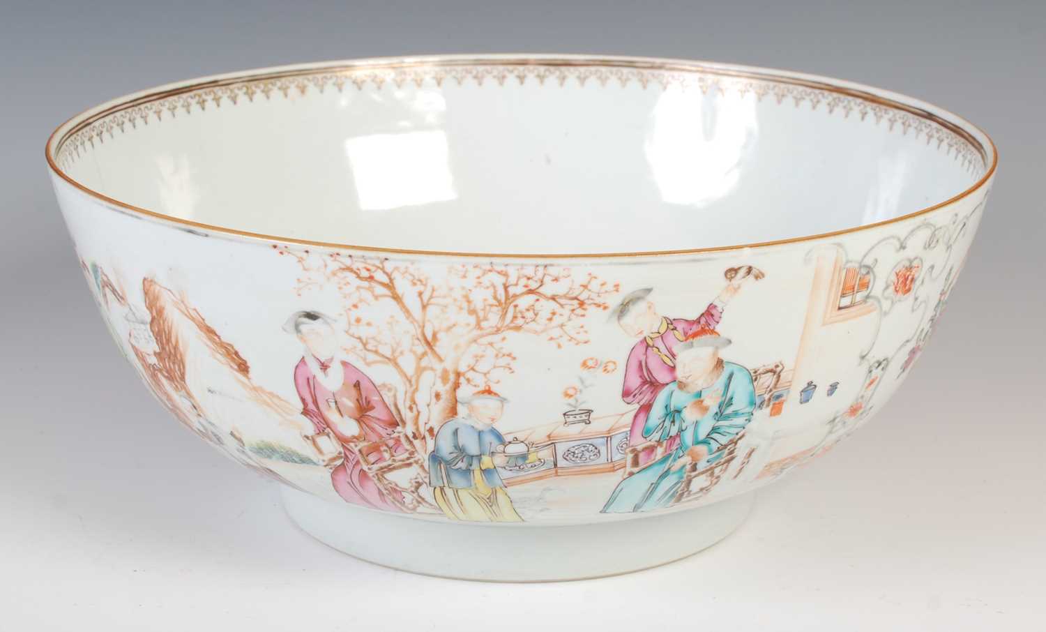 A Chinese porcelain famille rose punch bowl, Qing Dynasty, the interior decorated with peony
