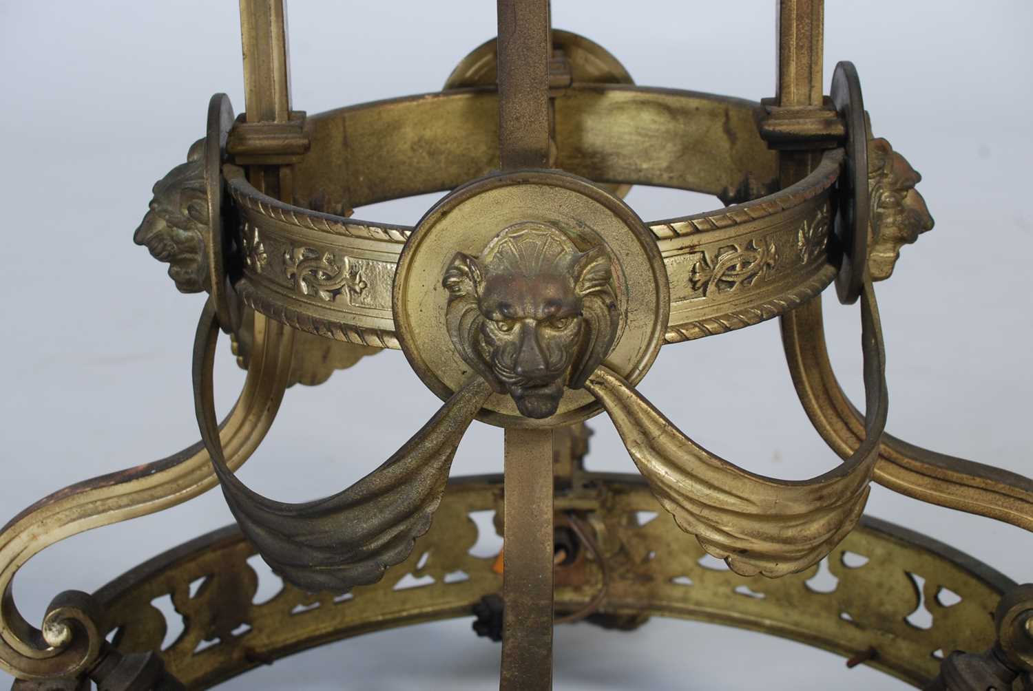 A late 19th/ early 20th century brass four-light hanging chandelier, set with four foliate cast - Image 5 of 6