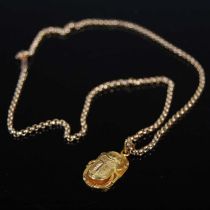 A late 19th century yellow metal necklace with yellow metal scarab beetle pendant, the necklace