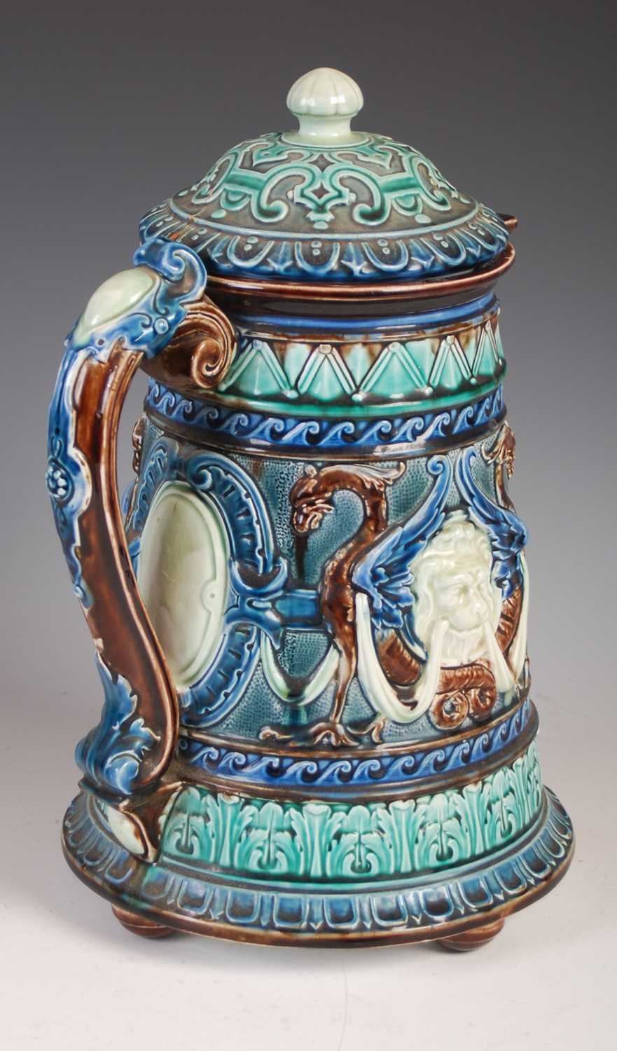 A large Swedish Rorstrand Majolica ewer and domed cover, decorated with lion masks, swags and winged - Image 2 of 7