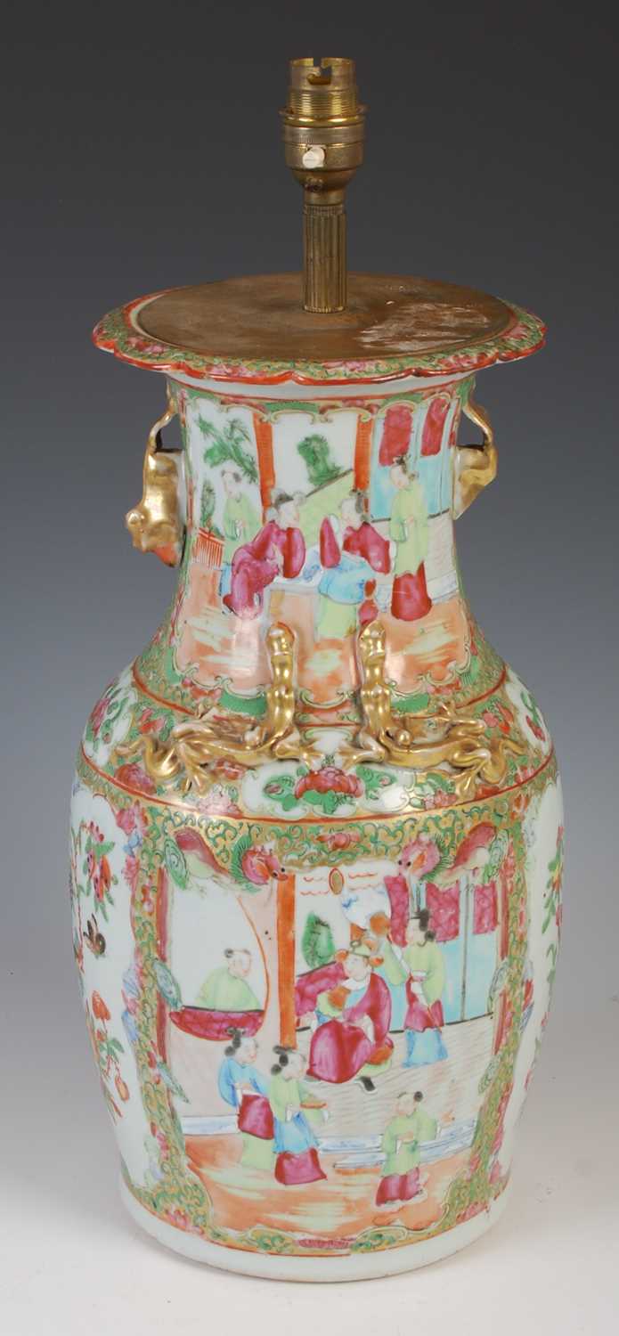 A Chinese porcelain famille rose canton vase converted to a table lamp, Qing Dynasty, decorated with