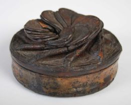 A leather circular snuff box with folded overlapping lid formed as a flower, with impressed simple