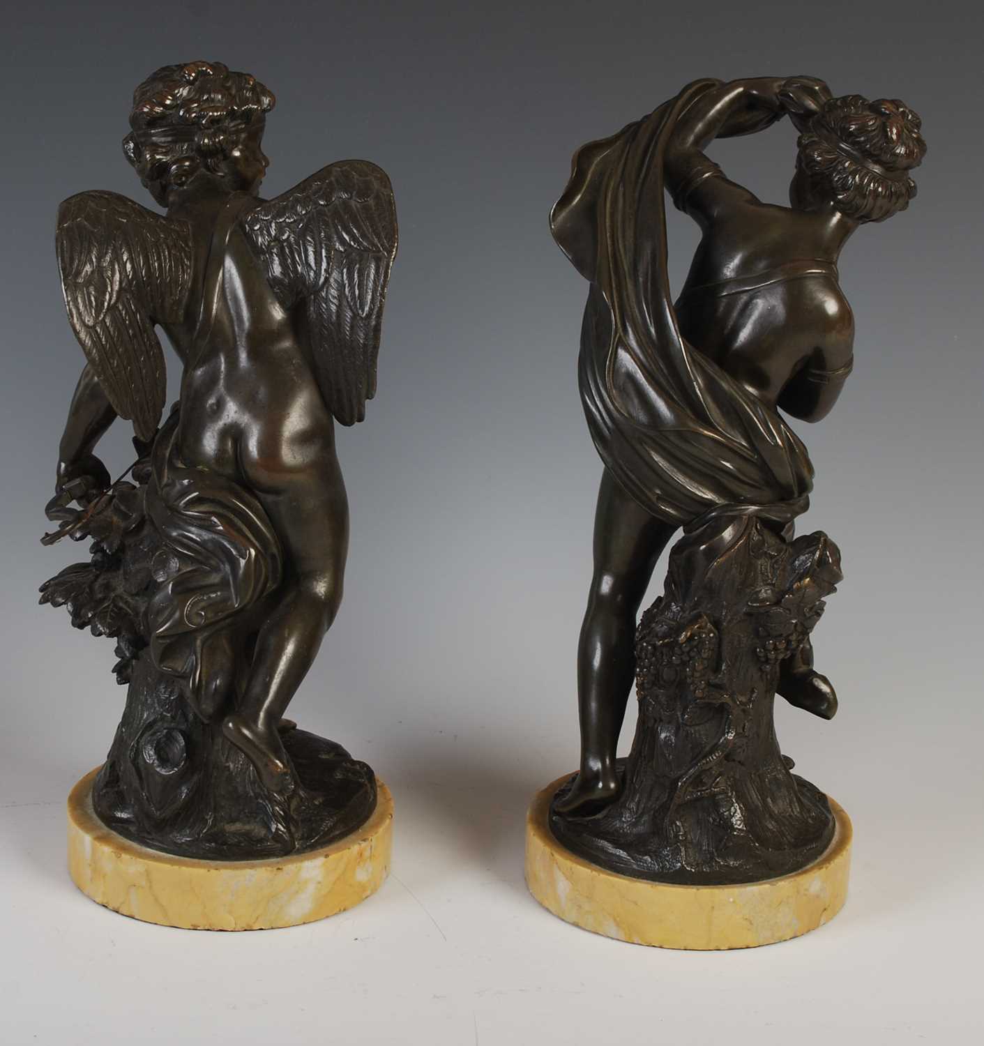 A pair of French bronze models of Cupid and a young girl, probably Psyche, in the manner of Louis- - Image 2 of 5